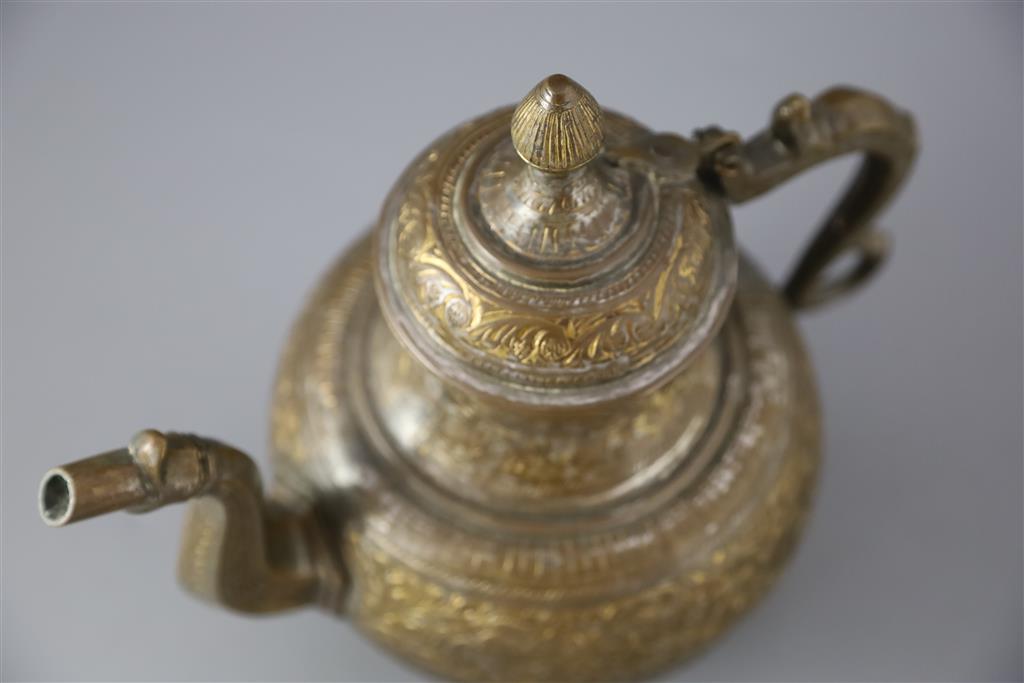 An 18th century Mughal Indian bronze and parcel gilt ewer, 26cm high